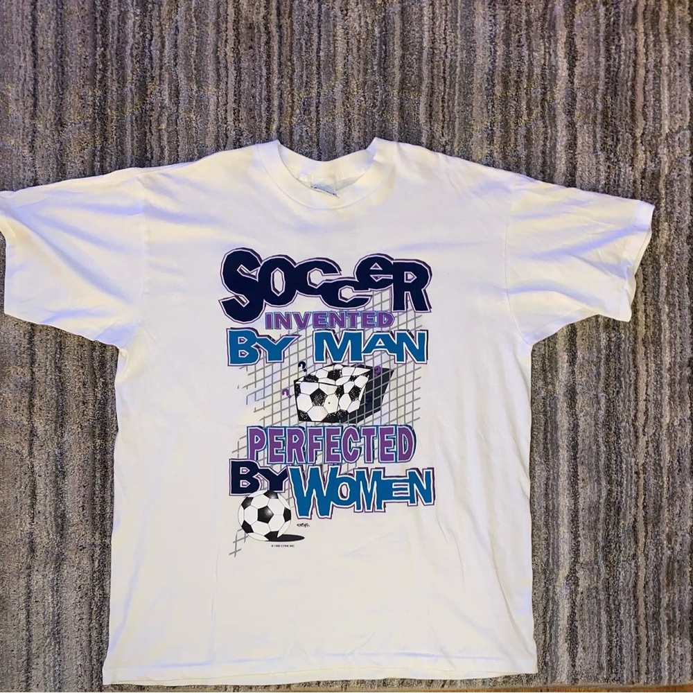 Vintage “Soccer invented by man perfected by women” 90s soccer T-shirt.